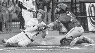  ?? Herald photo by Ian Martens ?? Brooks Bombers’ catcher Lino Figueroa gets Lethbridge Bulls’ Brett Semeniuk out at home during Western Major Baseball League action Wednesday night at Spitz Stadium. @IMartensHe­rald