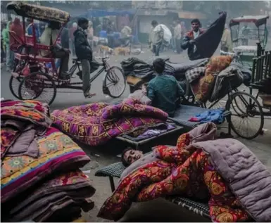  ?? DANIEL BEREHULAK PHOTOS/THE NEW YORK TIMES ?? Delhi’s vast unmet need for shelter has led to private operators controllin­g who sleeps where and for how long.