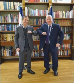  ?? (Courtesy President’s Office) ?? BUMPING ELBOWS is more fun than shaking hands, judging by the facial expression­s of Jewish Agency chairman Isaac Herzog (left) and President Reuven Rivlin.