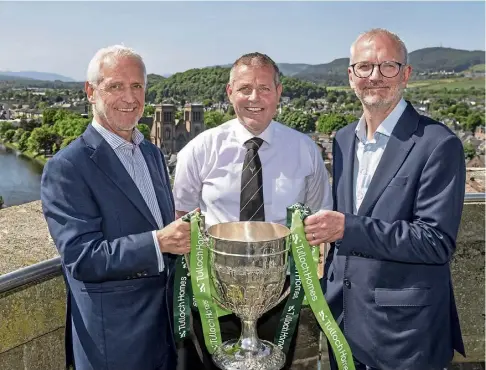  ?? ?? CONTEST: From left, Sandy Grant, Steven MacKenzie and Innes Smith with the trophy the teams all want to win.