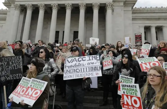  ??  ?? An anti-vaccinatio­n protest in Olympia, Washington, earlier this month (AP)