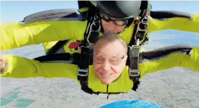  ?? Photos / Getty Images ?? Jack Nicholson skydives in the movieThe Bucket List; travel and experience­s such as swimming with sharks are high on people’s bucket lists.