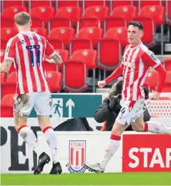  ??  ?? Lifeline: Northern Ireland internatio­nal Jordan Thompson celebrates with his Stoke City team-mate James Mcclean