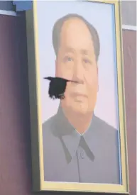  ?? ALY SONG / REUTERS FILES ?? A bird flies in front of a portrait of Mao Zedong
in Tiananmen Square last year.