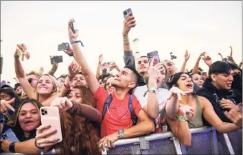  ?? Jamaal Ellis / Associated Press ?? The crowd watches as Travis Scott performs at Astroworld Festival at NRG park on Friday in Houston. At least eight people died and numerous others were injured in what officials described as a surge of the crowd at the music festival while Scott was performing.