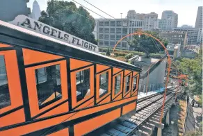  ?? RICHARD VOGEL/THE ASSOCIATED PRESS ?? The Angels Flight is once again ferrying visitors up and down downtown Los Angeles’ steep Bunker Hill, something it first did on New Year’s Eve 1901.