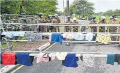  ?? AFP ?? Underpants hang on a barricade during a rally demanding the resignatio­n of President Gotabaya Rajapaksa in Colombo, Sri Lanka yesterday.