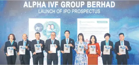 ?? ?? Lee (middle) alongside directors from Alpha IVF and AmInvestme­nt Bank during their prospectus launch yesterday.