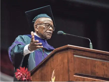  ?? WILL MCLELLAND/TUSCALOOSA NEWS ?? Civil rights lawyer Fred Gray speaks to graduates and their families after being awarded an honorary doctor of laws degree during the University of Alabama School of Law graduation ceremony at Coleman Coliseum in Tuscaloosa, Alabama, on Sunday.