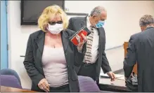  ?? Rachel Aston Las Vegas Review-journal @rookie__rae ?? Patricia Chappuis, left, and Marcel Chappuis, center, the owners of the now-shuttered Northwest Academy who face 45 counts of child abuse or neglect, appear Monday at Beatty Justice Court.