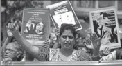  ?? REUTERS ?? People hold placards during a march to protest against atrocities on women, in Ahmedabad on Friday.