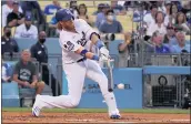  ?? KEITH BIRMINGHAM — STAFF PHOTOGRAPH­ER ?? The Dodgers’ Justin Turner gets a broken bat single against the Phillies in the first inning on Tuesday.