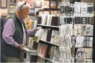  ??  ?? Matt Brooks shops at Books Inc., which has seen fewer customers since the hospital moved.