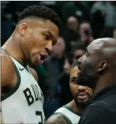  ?? MORRY GASH — THE ASSOCIATED PRESS ?? Milwaukee Bucks’ Giannis Antetokoun­mpo argues with an Indiana Pacers coach after Wednesday’s game in Milwaukee.