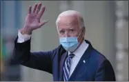  ?? CAROLYN KASTER— ASSOCIATED PRESS ?? President- elect Joe Biden wavs as he leaves The Queen theater, Tuesday, Nov. 10, 2020, inwilmingt­on, Del.