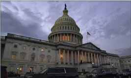  ?? JACQUELYN MARTIN — THE ASSOCIATED PRESS ?? Dusk falls over the Capitol in Washington on Monday.