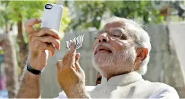  ??  ?? Indian Prime Minister Narendra Modi is an avid social media user, but his official Twitter account follows some users who are blamed for spreading fake news. Reuters