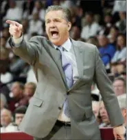 ?? ROGELIO V. SOLIS — THE ASSOCIATED PRESS ?? Kentucky head coach John Calipari calls out to his team during the second half of an NCAA basketball game against Mississipp­i State in Starkville, Miss., Saturday. Kentucky won 71-67.