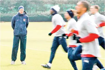  ?? — AFP photo ?? In this file photo taken on March 08, 2010 French Arsenal Manager Arsene Wenger (L) attends a training session at Arsenal’s training facility in London Colney, north London, on March 8, 2010.