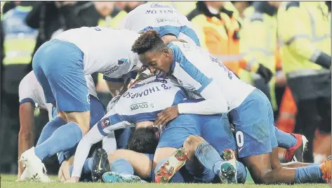  ?? Picture: Joe Pepler ?? BUNDLES OF FUN Pompey’s players celebrate Andre Green’s last-gasp strike at Carrow Road