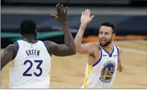  ?? ERIC GAY — THE ASSOCIATED PRESS, FILE ?? Warriors guard Stephen Curry (30) celebrates with teammate Draymond Green (23) during the second half against the Spurs on Feb. 9 in San Antonio.