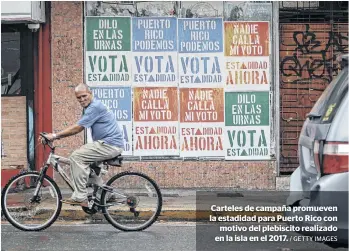  ?? / GETTY IMAGES ?? Carteles de campaña promueven la estadidad para Puerto Rico con
motivo del plebiscito realizado en la isla en el 2017.