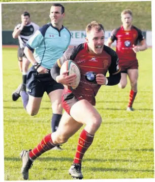  ??  ?? RGC’s scrum-half Efan Jones on his way to adding a five-pointer