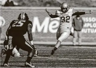  ?? Handout / Getty Images ?? Vanderbilt’s Sarah Fuller makes college football history as she kicks off for the Commodores to start the second half against the Missouri Tigers at Memorial Stadium on Saturday.