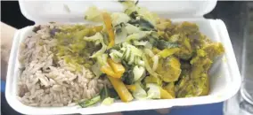  ??  ?? A medium-sized coconut curried chicken with rice and peas and sautéed vegetables