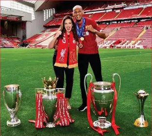  ?? INSTAGRAM ?? Trophy/wife: Fabinho and Rebeca celebrate Christmas and line up the Anfield silverware