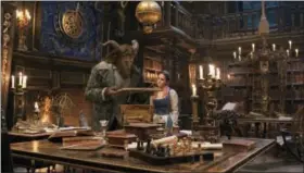  ?? DISNEY VIA AP ?? This image released by Disney shows Dan Stevens as The Beast, left, and Emma Watson as Belle in a live-action adaptation of the animated classic “Beauty and the Beast.”