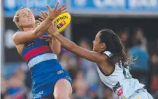  ??  ?? Adelaide’s Tayla Thorn (right) and Bulldogs Katie Brennan clash