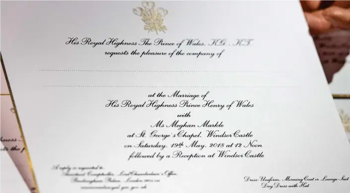  ??  ?? Traditiona­l touch: The gold-edged invitation­s bear the Prince of Wales’s badge and were printed on a machine from the 1 30s, using American ink on English card