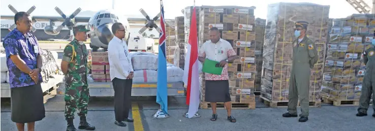  ??  ?? Minister for Disaster Management, Rural and Maritime Developmen­t Inia Seruiratu (fourth from left) receiving the consignmen­t from the Indonesian Ambassador, Benjamin Scott Carnadi (third from left), at the Nadi Internatio­nal Airport on May 15, 2020.