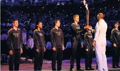  ??  ?? Adelle Tracey was one of seven young athletes chosen by Olympic legends to light the 2012 Olympic cauldron