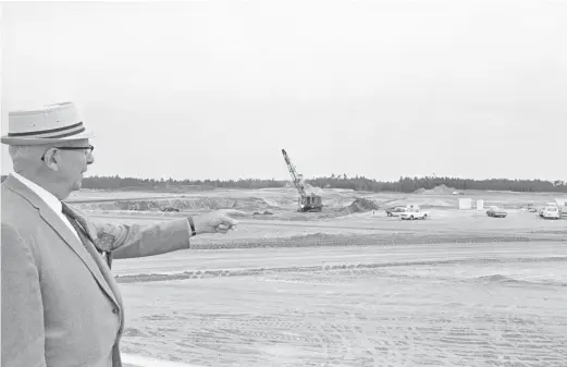  ?? JIM KERLIN/AP ?? Joe Fowler, 75, a retired Navy admiral, points out the spot being prepared for the Disney World project near Orlando, Florida, on May 2, 1969. The idea was presented to Florida lawmakers 55 years ago: Let Disney form its own government, and in exchange it would create a futuristic city of tomorrow.