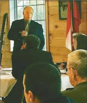  ??  ?? Sherman Ross, city council member, addresses GICH program representa­tives and others during site visit to Rockmart.