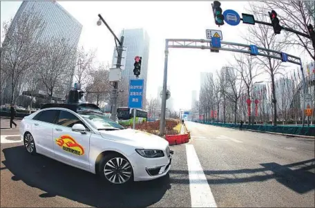  ?? VCG via Getty Images ?? CHINA ranks 20th of 25 countries in an index measuring their preparedne­ss for autonomous vehicles. Above, a self-driving car in Beijing.