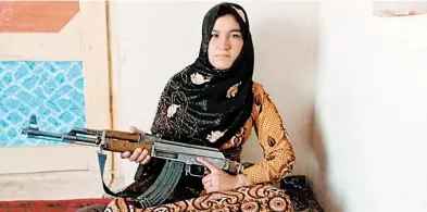  ?? GHOR DISTRICT GOVERNMENT ?? Qamar Gul fought off Taliban attackers who killed her parents. Her story reveals the complicate­d crosscurre­nts of the war.