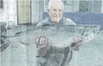  ??  ?? A whopper . . . Fred Inder with a 10.2kg salmon he caught in the Waitaki River.