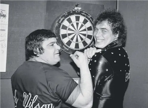  ??  ?? 0 Bobby George and Jocky Wilson toured the world together in their heyday George, far left, still throws the odd dart buut Wilson, left, died in 2012