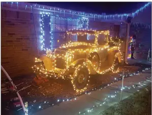  ?? SUBMITTED ?? This 1929 Ford Model A truck is decorated in Christmas lights at the Smith Family Light Show, 1301 Wallis Drive in Searcy. The truck is on loan from Casey Arms Artisan. Seth Brown of Searcy programmed the lights to music.