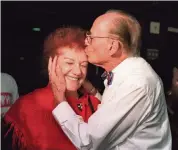  ?? MARICE COHN BAND Miami Herald file ?? A kiss for wife Edith from Seymour Gelber in 1995 after he won the Miami Beach mayoral race again.