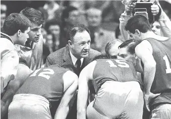  ?? AP FILE PHOTO/TOM STRICKLAND ?? Actor Gene Hackman gives fictional Hickory High School basketball players instructio­ns during filming of the final game of the movie “Hoosiers” at Hinkle Fieldhouse on the Butler University campus in Indianapol­is. The 1986 film was voted the No. 1 sports movie of all time by the sports staff of The Associated Press.