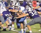  ?? / Jeremy Stewart ?? Trion’s Hagen Willingham (center) is tackled by Darlington’s Dawson Williams (25) and Tommy Atha Jr. (32) during the second quarter Friday night.