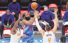  ?? MARY ALTAFFER/ASSOCIATED PRESS ?? James Harden (13) readies to shoot over Orlando’s Nikola Vucevic (9) in his debut with the Brooklyn Nets after being acquired in a trade with Houston.