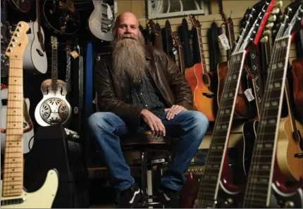  ?? PETER LEE, RECORD STAFF ?? Dan Walsh, president of Guitars for Kids, at The Guitar Corner in Kitchener on Friday. Now his non-profit will help more youngsters. “The coolest thing for me,” he says, “is if one of these kids winds up being one of the world’s next (great) guitar...