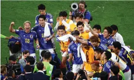  ?? Photograph: Anadolu Agency/ Getty Images ?? Japan’s players celebrate after winning against Germany.