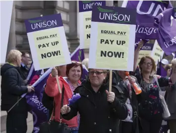  ??  ?? Equal pay protesters before the settlement was agreed