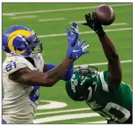  ?? (AP/Ashley Landis) ?? New York Jets free safety Marcus Maye (right) breaks up a pass intended for Los Angeles Rams tight end Gerald Everett during the second half Sunday in Inglewood, Calif. The Jets won 23-20 to snap a 13-game losing streak, the longest in franchise history.